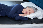 Woman.Sleeping.On.Mattress.Cover